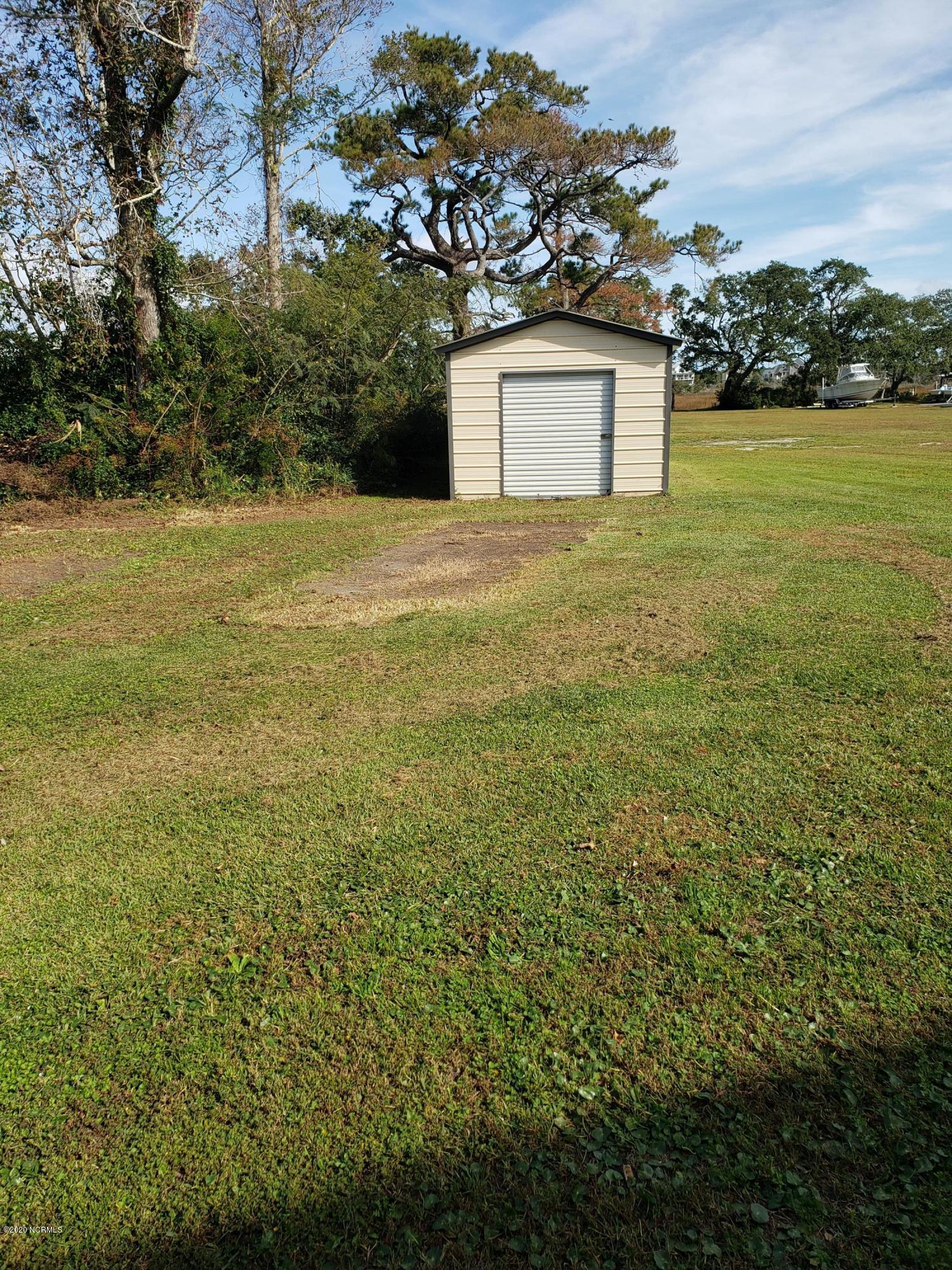 1806 Paulette Road Morehead City, NC 28557 - Photo 36 of 39 10x30 storage building has a raise floor and is wired for electricity