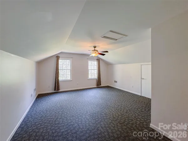 a view of a room that has a window in it