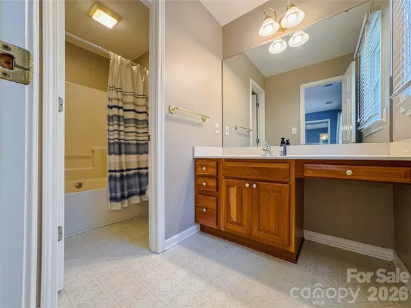 a kitchen with a sink and a stove top oven