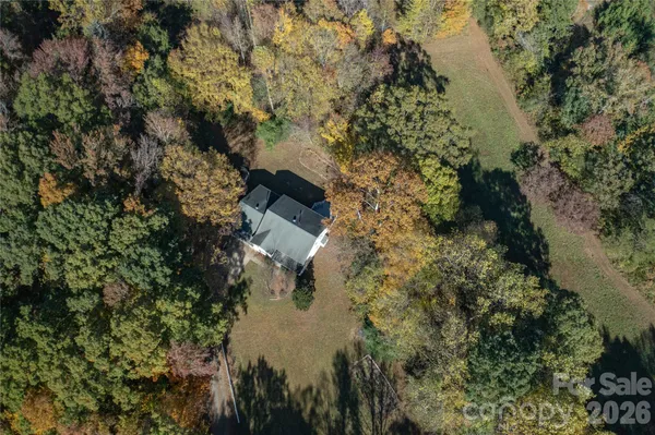 a aerial view of a house with a yard