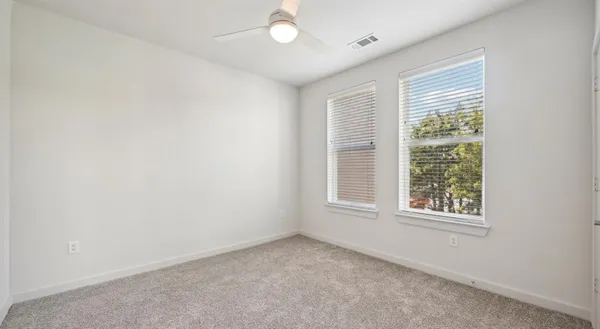 a large kitchen with stainless steel appliances granite countertop a refrigerator a oven and a sink with wooden floor