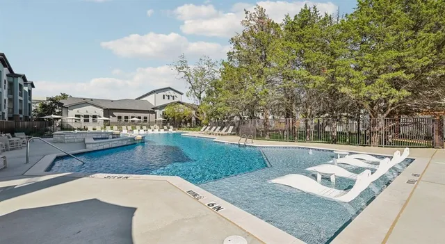 a view of a backyard with sitting area