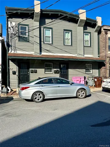 a car parked in front of a house