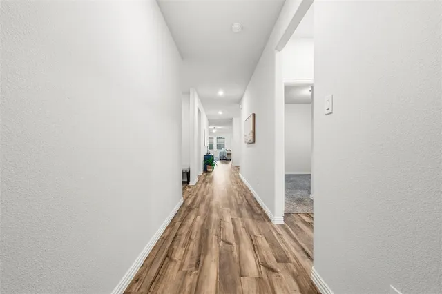 a front view of a house with swimming pool and sitting area