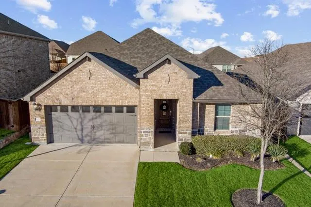 a front view of house with yard garage and green space