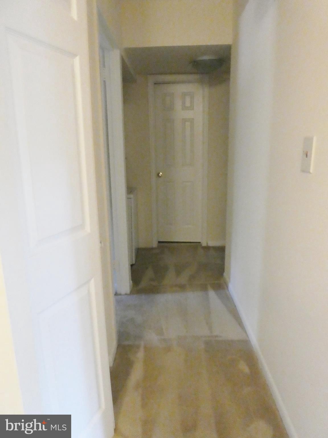 2220 Castle Rock Square, Unit 1B Reston, VA 20191 - Photo 10 of 36 Carpeted hallway to BR area