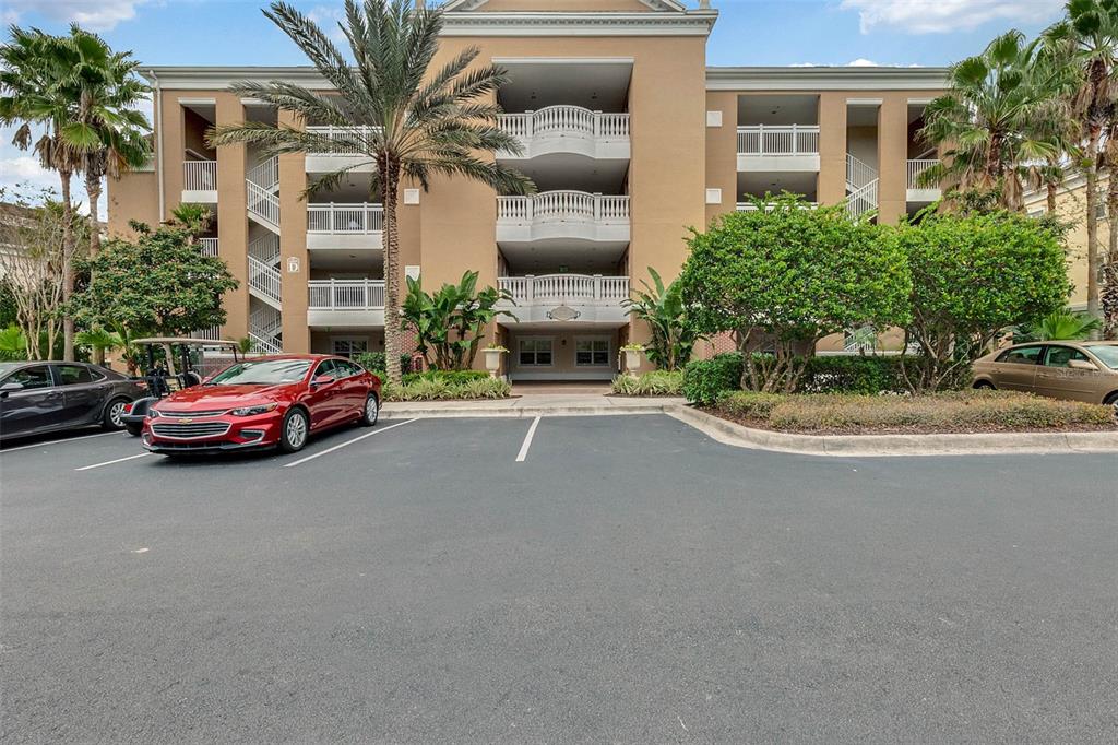 7606 Sandy Ridge Drive, Unit 304 Reunion, FL 34747 - Photo 1 of 1 a cars parked in front of a house