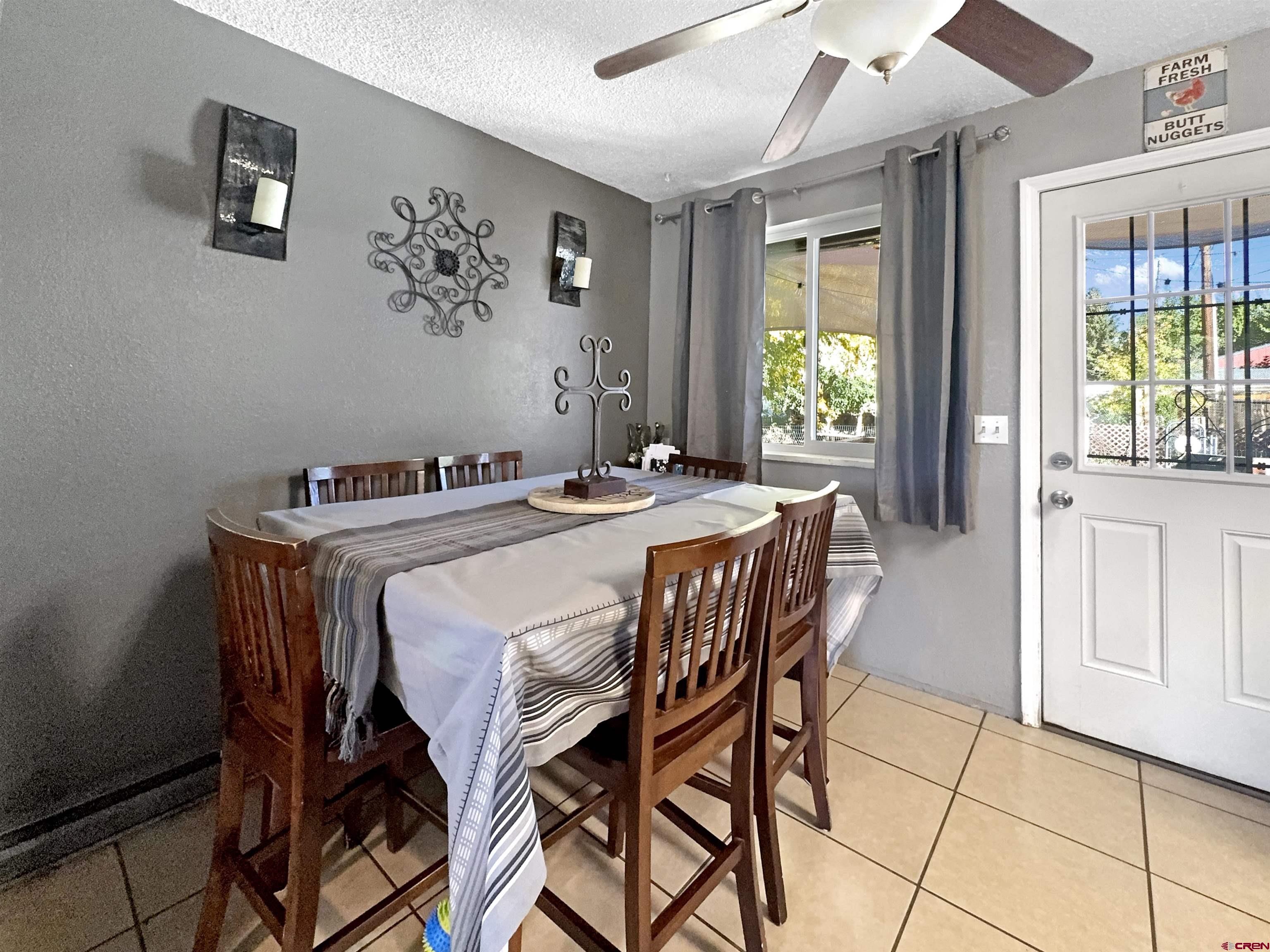8 West 10th Street Cortez, CO 81321 - Photo 22 of 24 a dining room with a wooden table and chairs