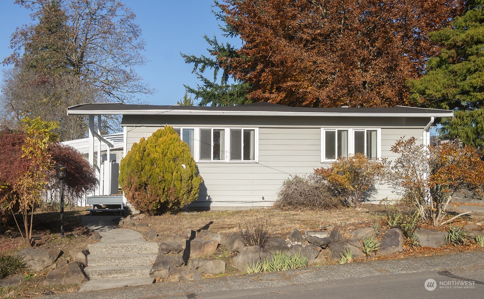2210 Northeast 8th Street Renton, WA 98056 - Photo 1 of 24 front view of house with a yard