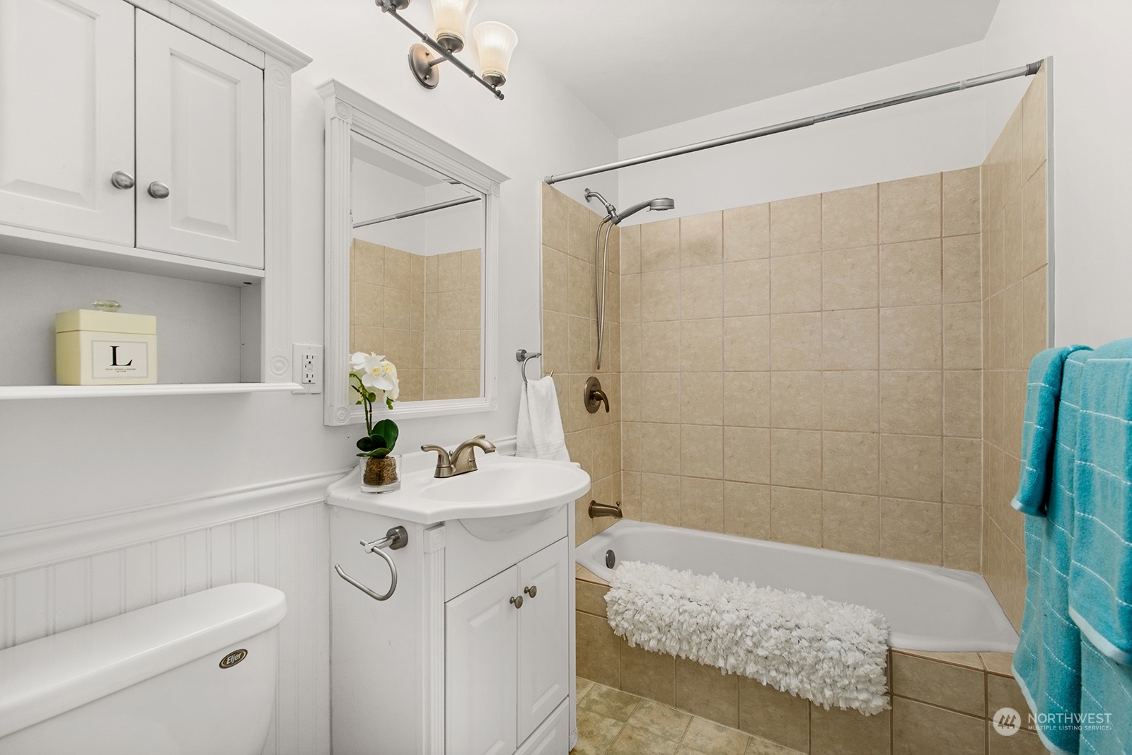 2210 Northeast 8th Street Renton, WA 98056 - Photo 18 of 24 a bathroom with a sink a toilet and shower