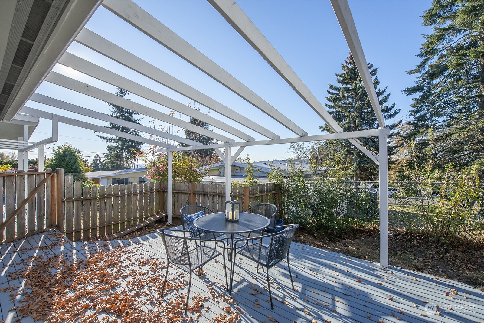 2210 Northeast 8th Street Renton, WA 98056 - Photo 23 of 24 a patio with table and chairs and potted plants