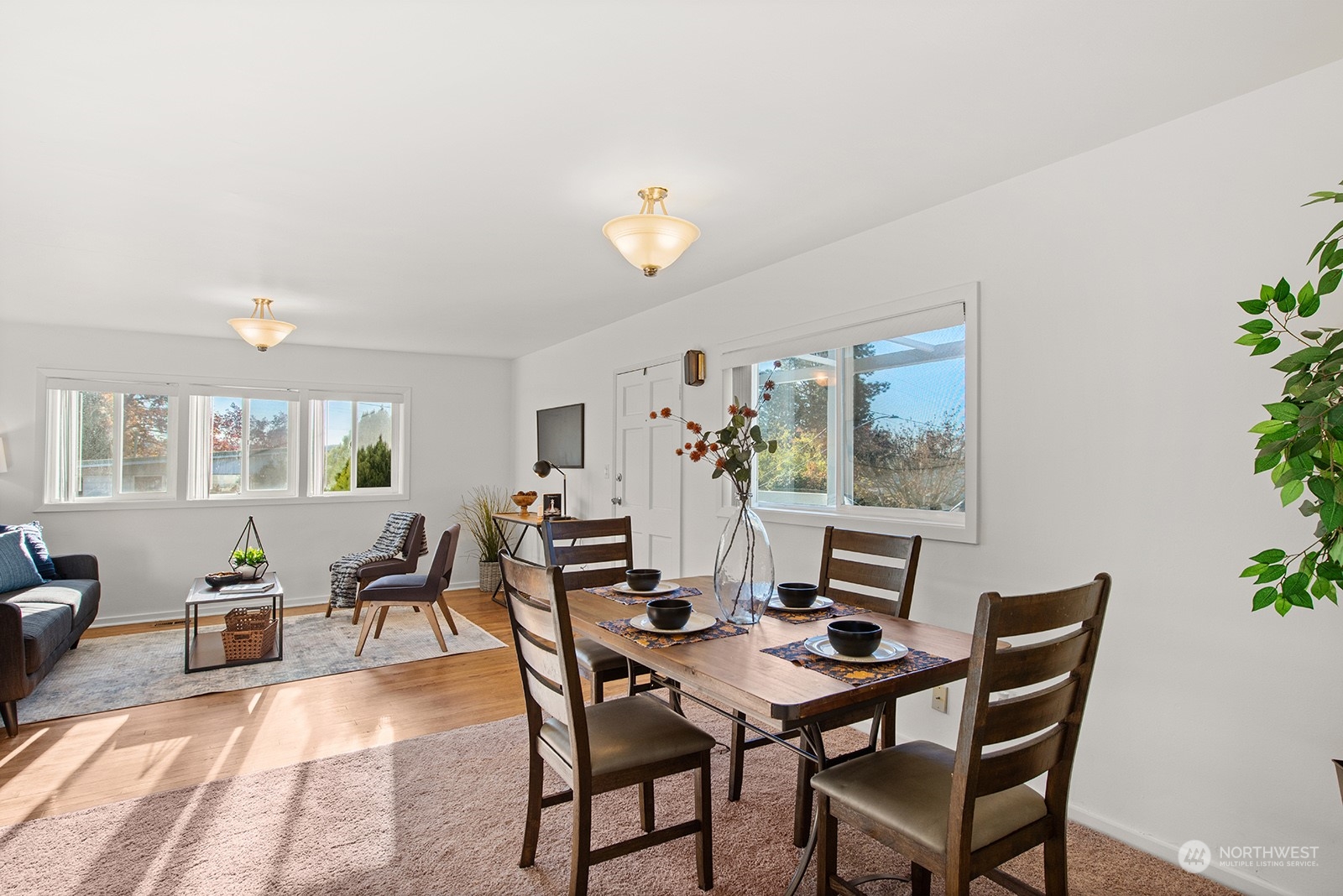 2210 Northeast 8th Street Renton, WA 98056 - Photo 6 of 24 a view of a dining room with furniture and chandelier