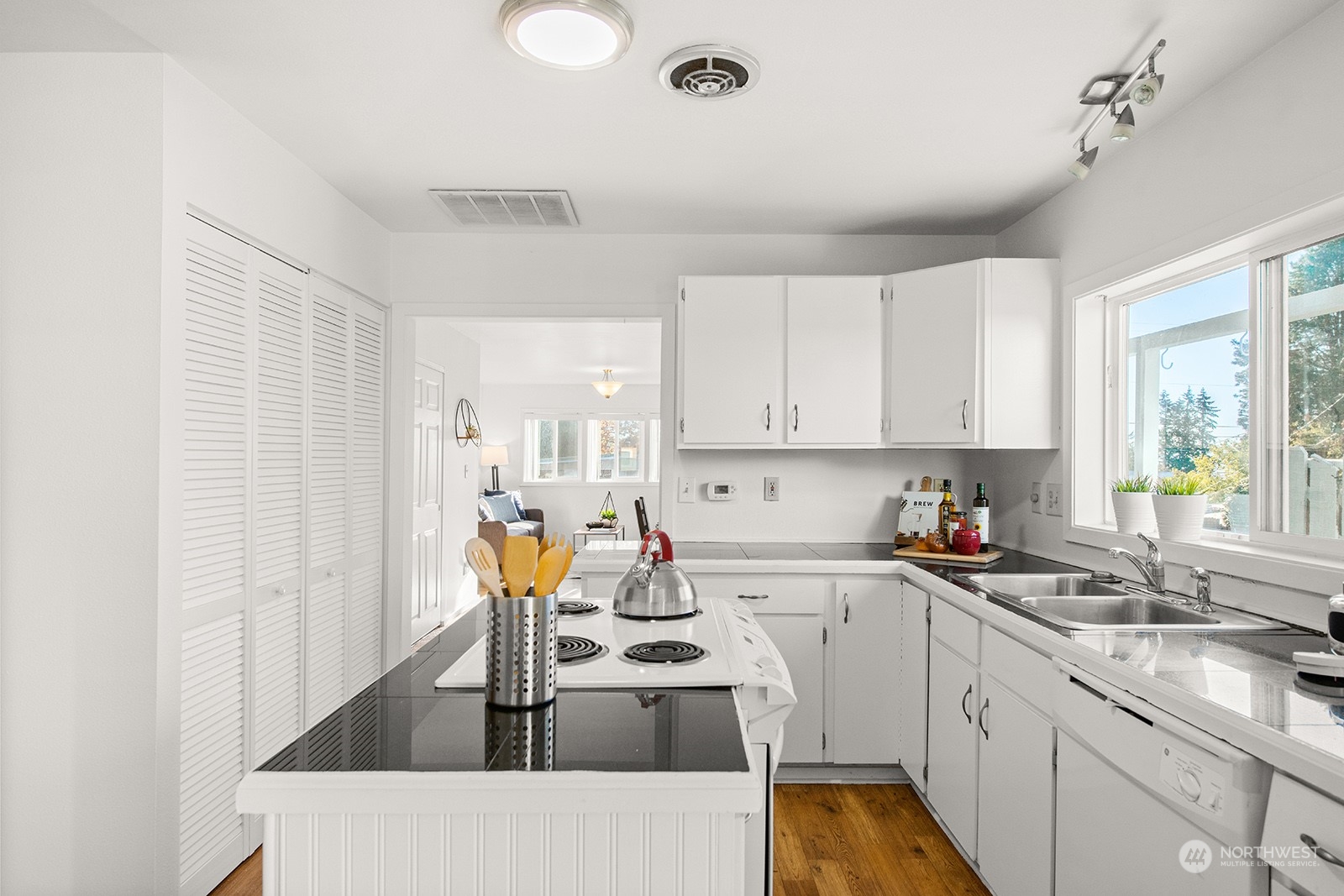 2210 Northeast 8th Street Renton, WA 98056 - Photo 9 of 24 a kitchen with a sink appliances and cabinets
