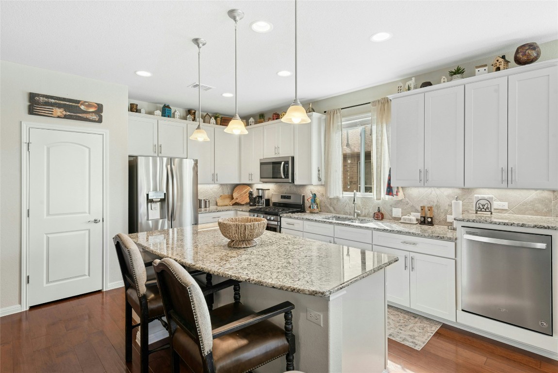 704 Archer Lane Georgetown, TX 78633 - Photo 12 of 40 Kitchen and Breakfast Bar Island