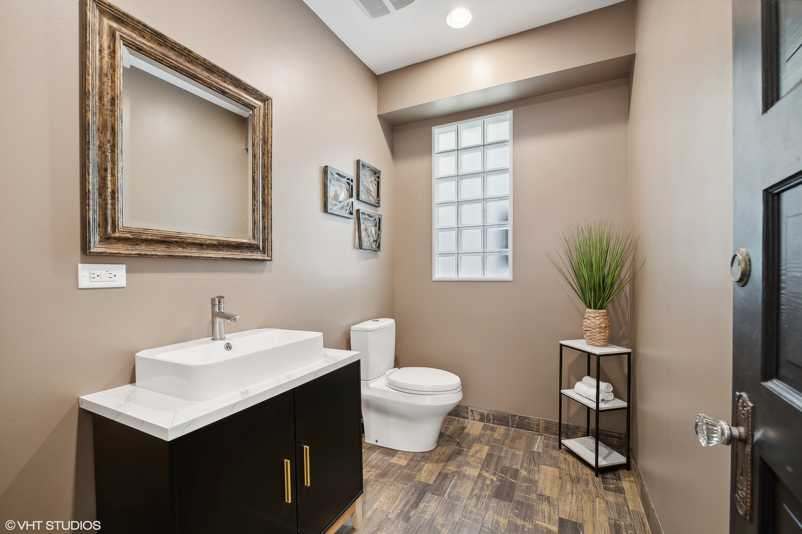 4159 North Bell Avenue Chicago, IL 60618 - Photo 11 of 42 a bathroom with a sink toilet and a window