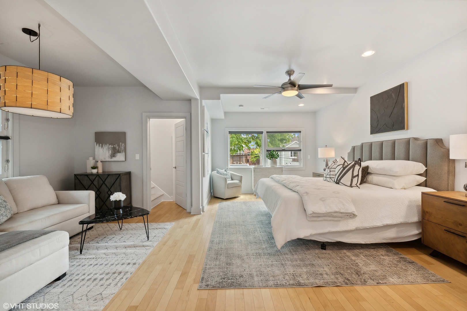 4159 North Bell Avenue Chicago, IL 60618 - Photo 17 of 42 a living room with furniture a ceiling fan a rug and a window