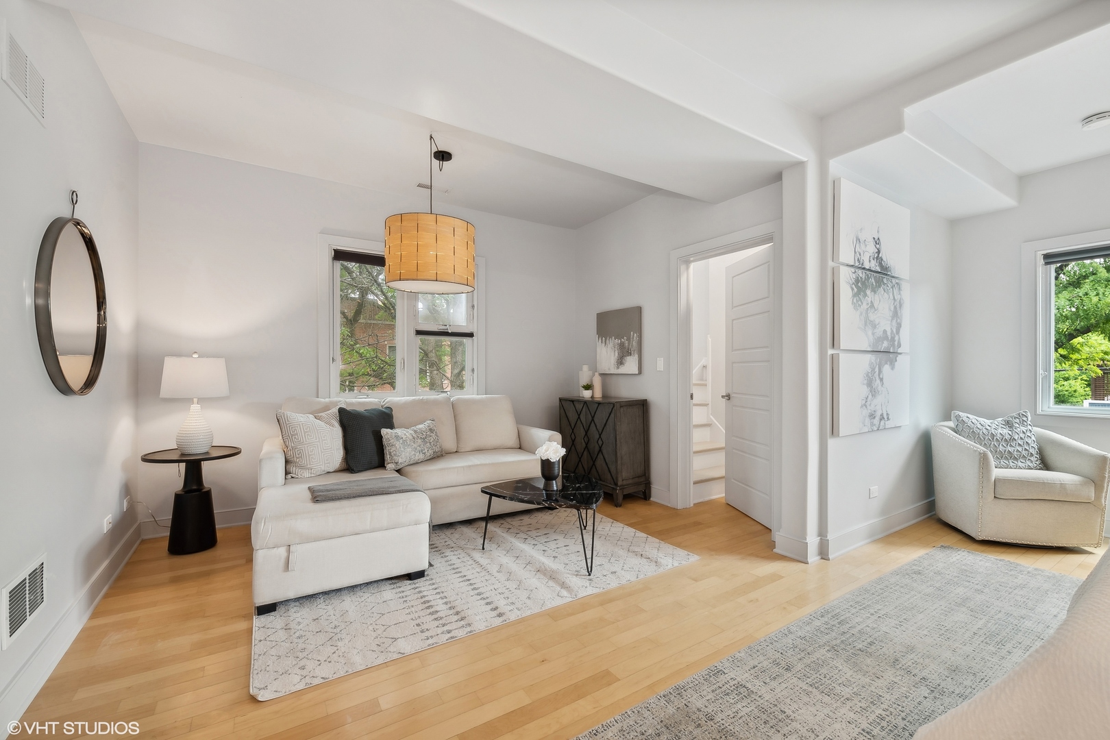 4159 North Bell Avenue Chicago, IL 60618 - Photo 19 of 42 a living room with furniture a chandelier and a window