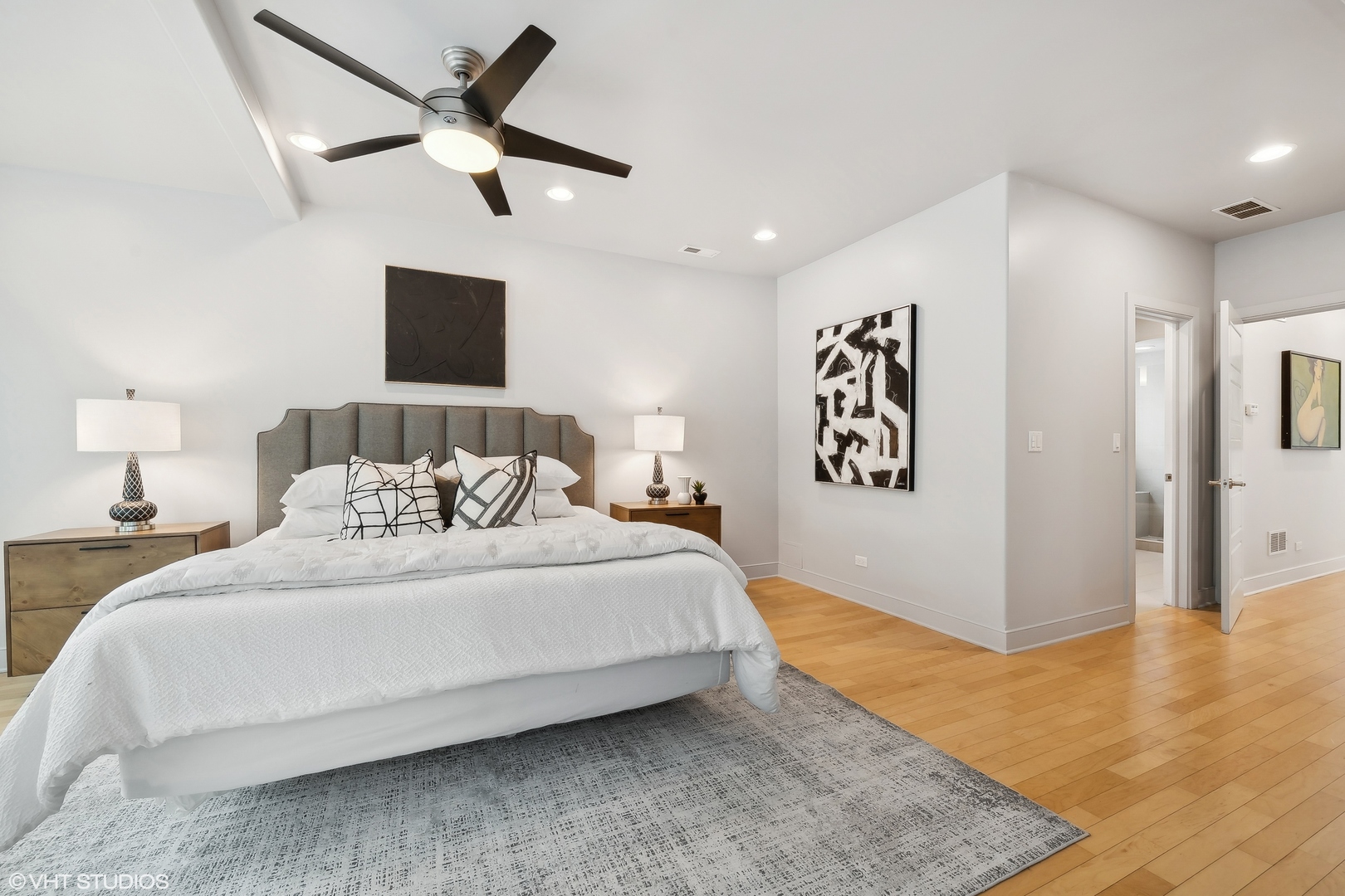 4159 North Bell Avenue Chicago, IL 60618 - Photo 20 of 42 a spacious bedroom with a bed and a ceiling fan