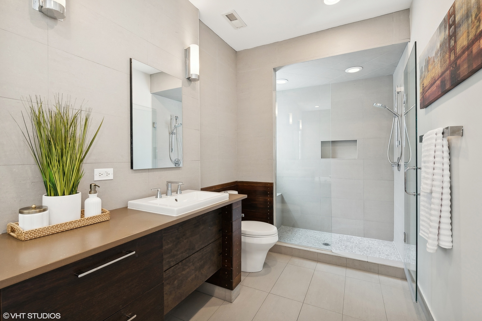 4159 North Bell Avenue Chicago, IL 60618 - Photo 23 of 42 a bathroom with a double vanity sink a toilet and a mirror