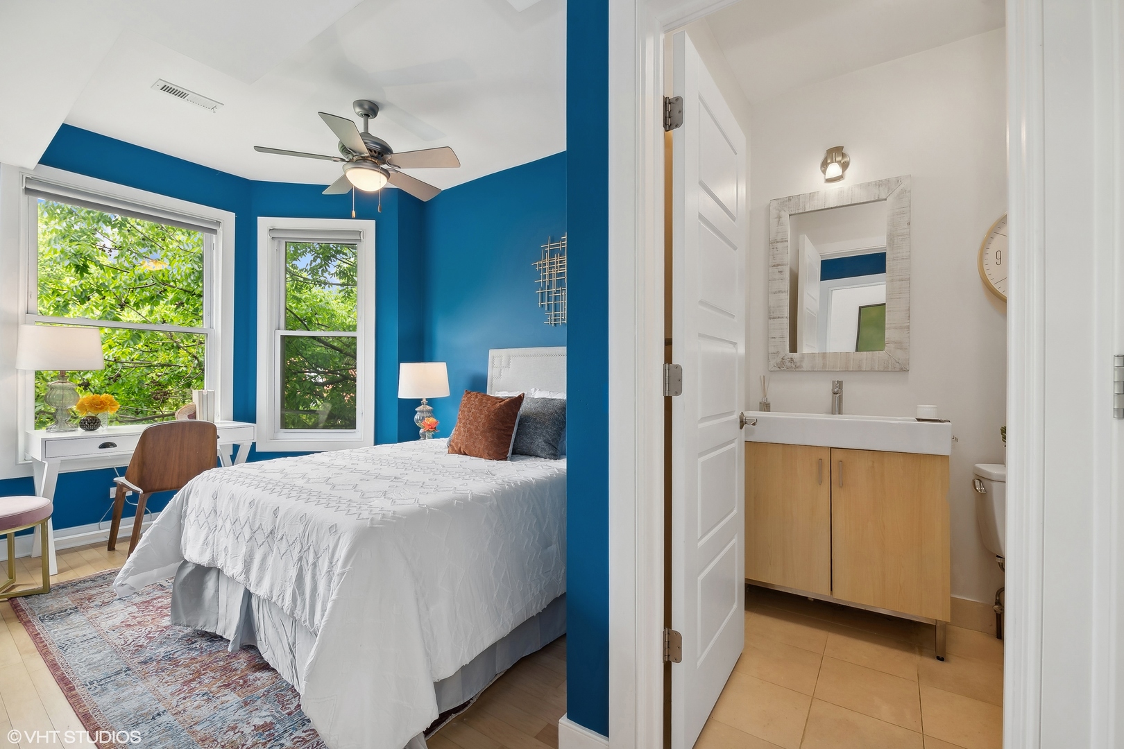 4159 North Bell Avenue Chicago, IL 60618 - Photo 25 of 42 a bedroom with a large bed and a chandelier