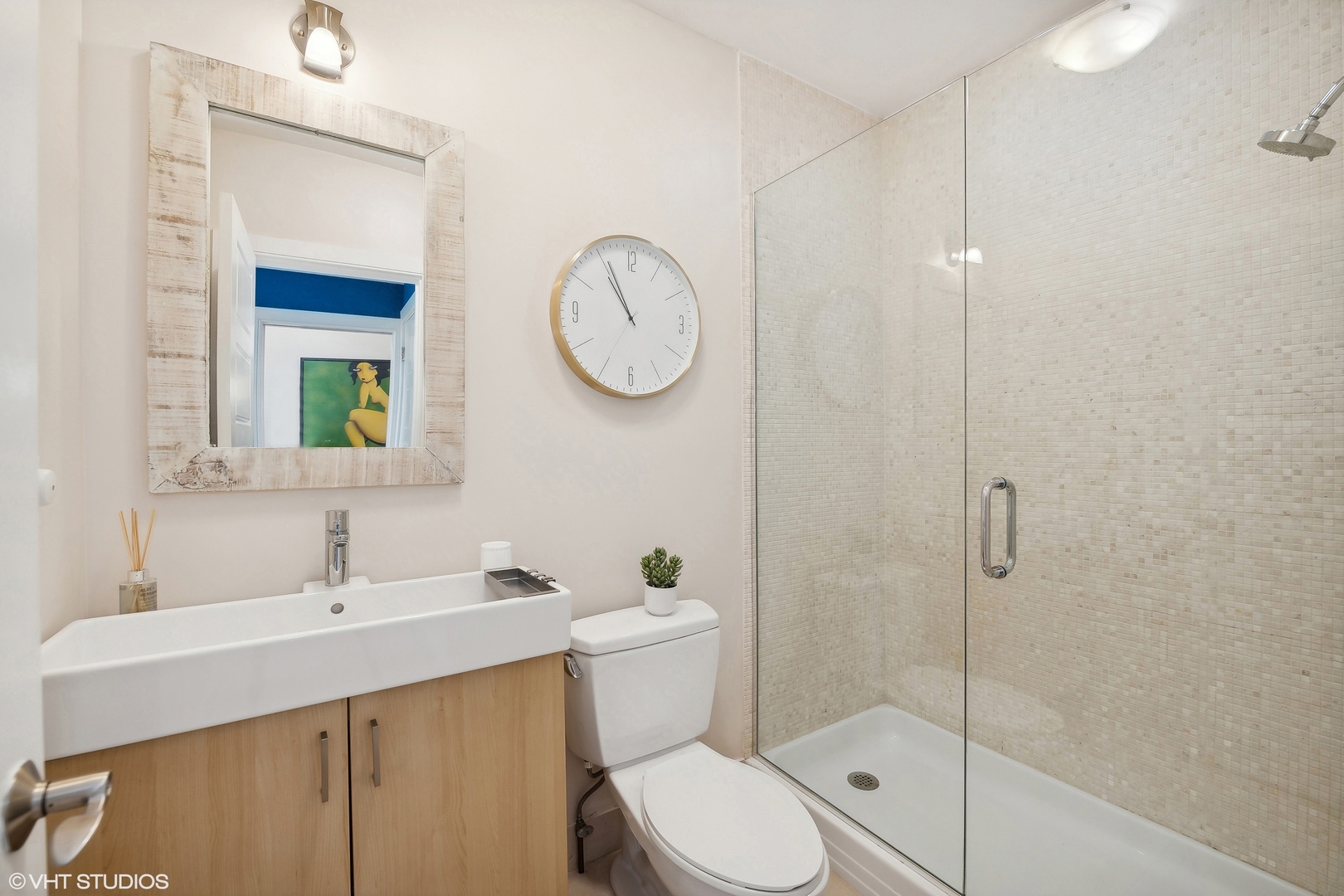 4159 North Bell Avenue Chicago, IL 60618 - Photo 27 of 42 a bathroom with a sink a toilet and shower