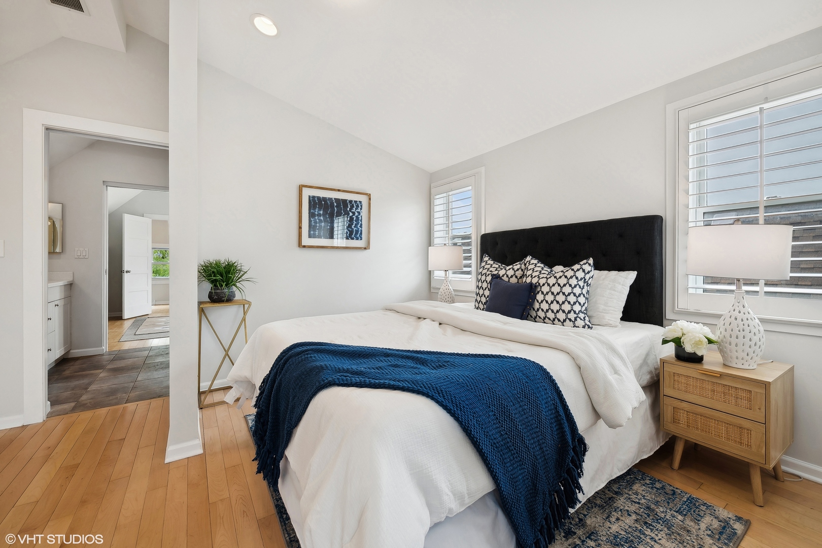 4159 North Bell Avenue Chicago, IL 60618 - Photo 30 of 42 a spacious bedroom with a bed and wooden floor