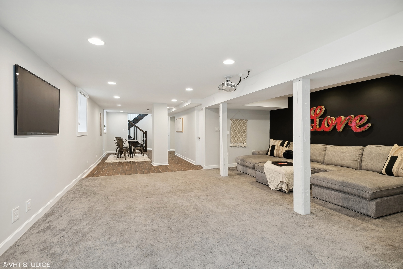 4159 North Bell Avenue Chicago, IL 60618 - Photo 36 of 42 a living room with furniture and a flat screen tv