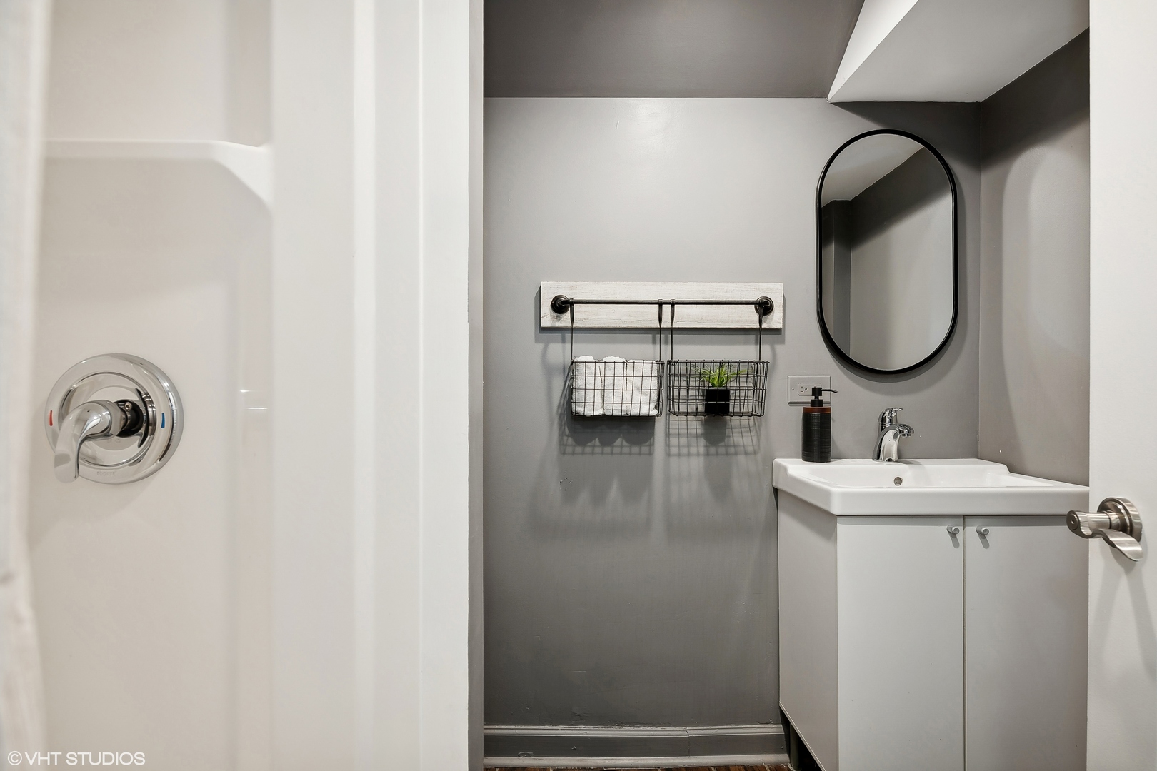 4159 North Bell Avenue Chicago, IL 60618 - Photo 38 of 42 a bathroom with a sink and a mirror