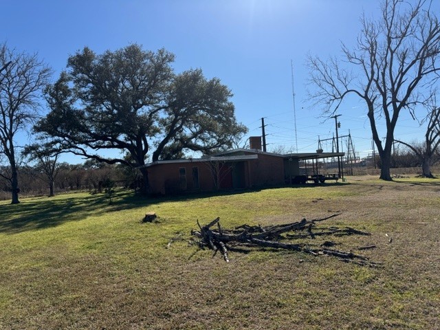 2119 Walnut Street Columbus, TX 78934 - Photo 11 of 12 a view of a backyard with wooden fence
