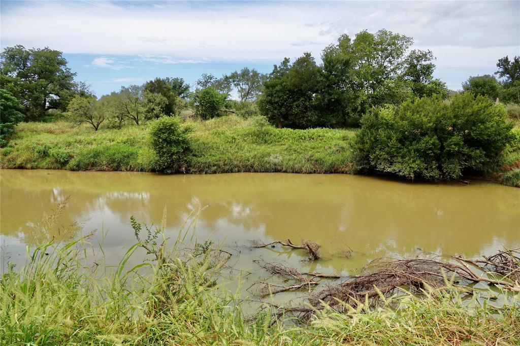 392 County Road 433 Mullin, TX 76864 - Photo 5 of 17 a view of a lake with a mountain in the background