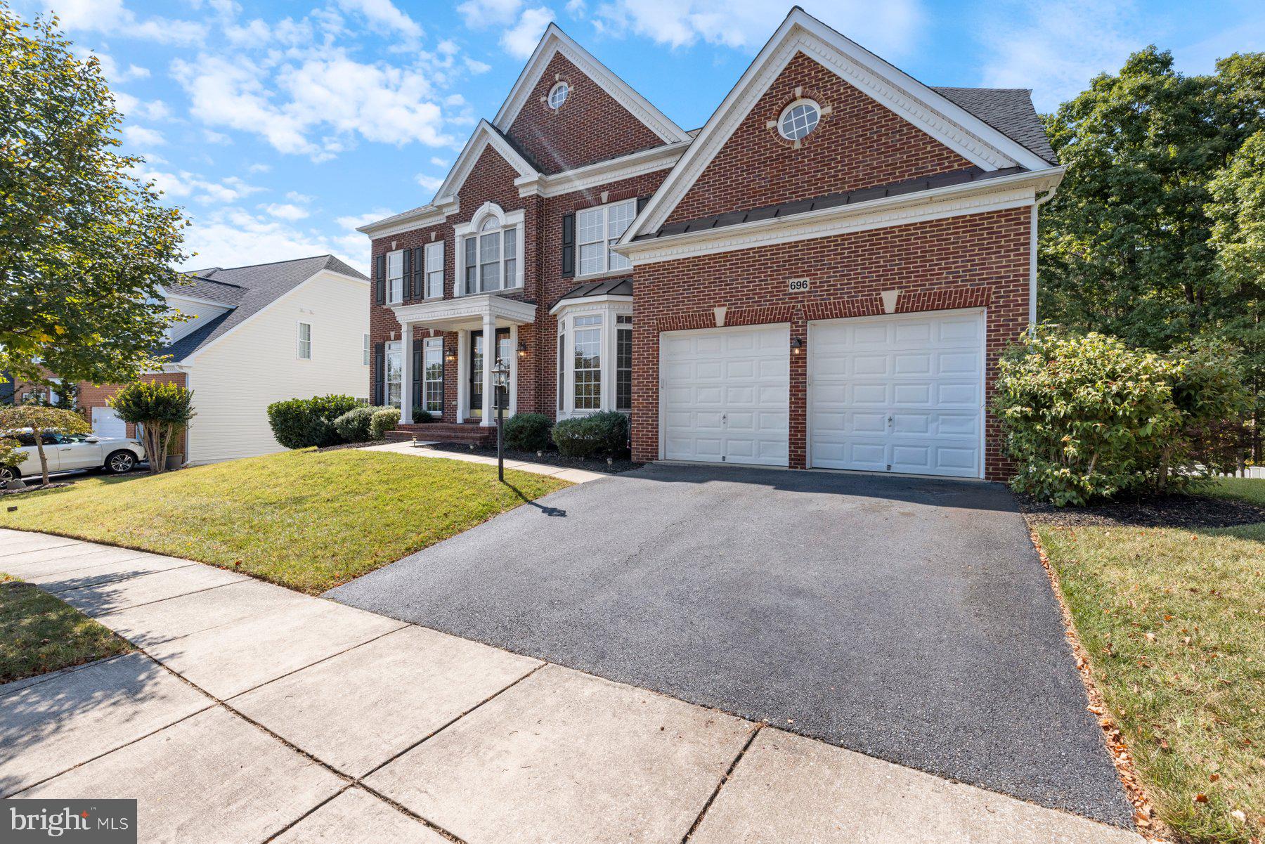696 Reliance Drive Odenton, MD 21113 - Photo 3 of 82 Exterior Front-2 Car Garage w/ Spacious Driveway