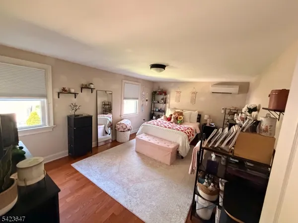a bed room with bed and a tv