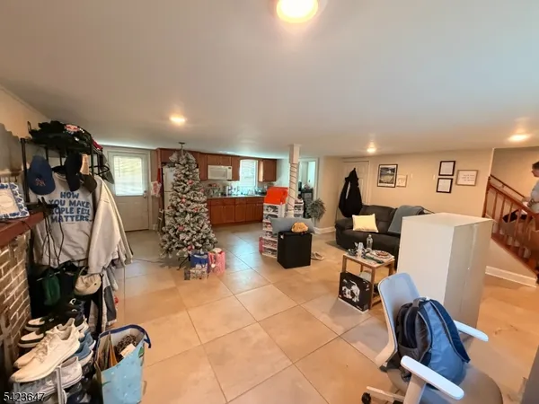 a view of a livingroom with workspace and a couch