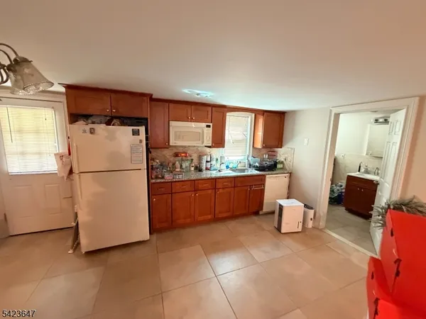 a kitchen with stainless steel appliances a refrigerator and a stove