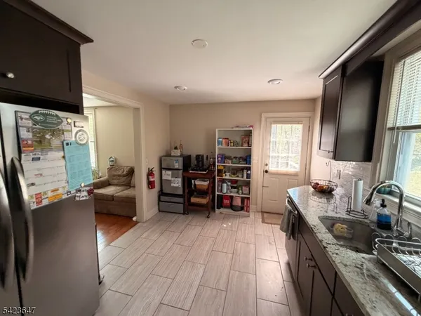 a bedroom with furniture and a flat screen tv
