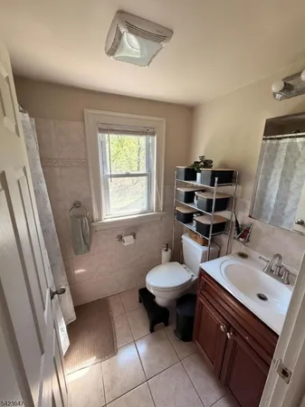 a bathroom with a sink toilet and tub