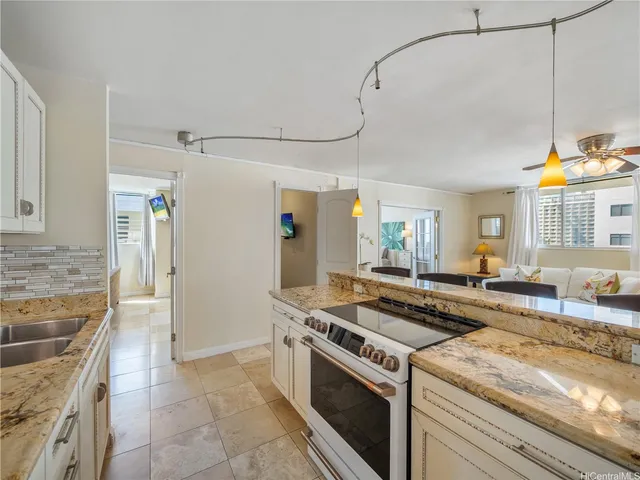 a kitchen with a stove and a sink