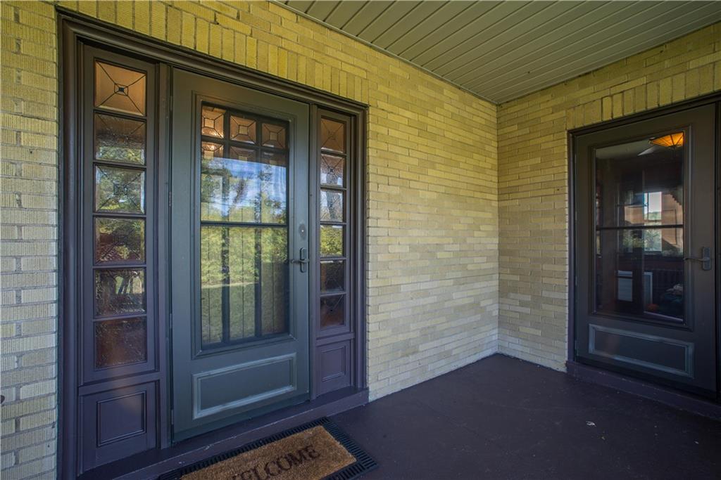 172 Bellbridge Road Elizabeth, PA 15037 - Photo 2 of 25 The inviting covered front porch offers two entries. On the left is the mission-style main entry door to the foyer, which is accented with sidelights. The door to the right opens to the den.