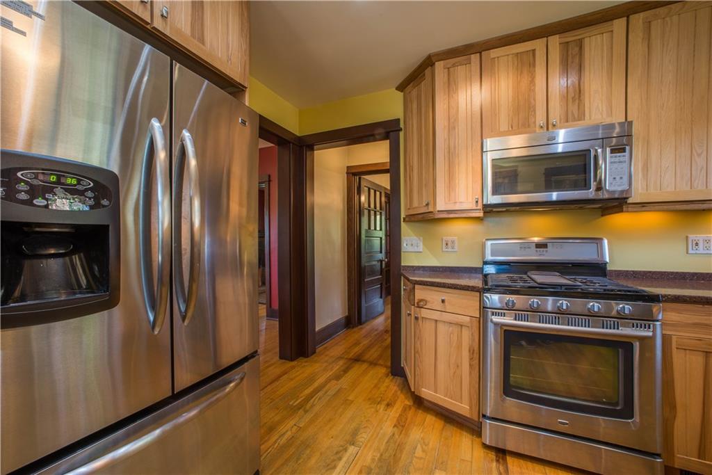 172 Bellbridge Road Elizabeth, PA 15037 - Photo 5 of 25 The equipped kitchen has been updated with hickory cabinets, stainless steel appliances, and quartz countertops. The entryway at the center of the photo leads to the foyer.