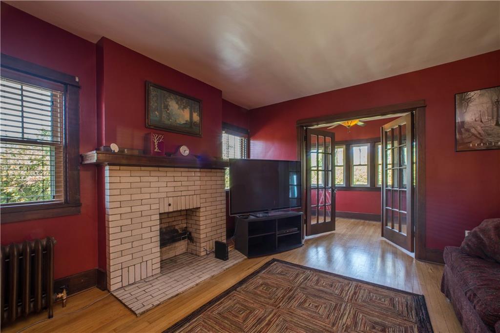 172 Bellbridge Road Elizabeth, PA 15037 - Photo 8 of 25 The warm wall tones in the living room create a cozy environment in the spacious living room. Of course, the decorative fireplace, flanked by windows overlooking the right side yard, and French doors to the den also do their part in adding to the welcoming feel in this space.