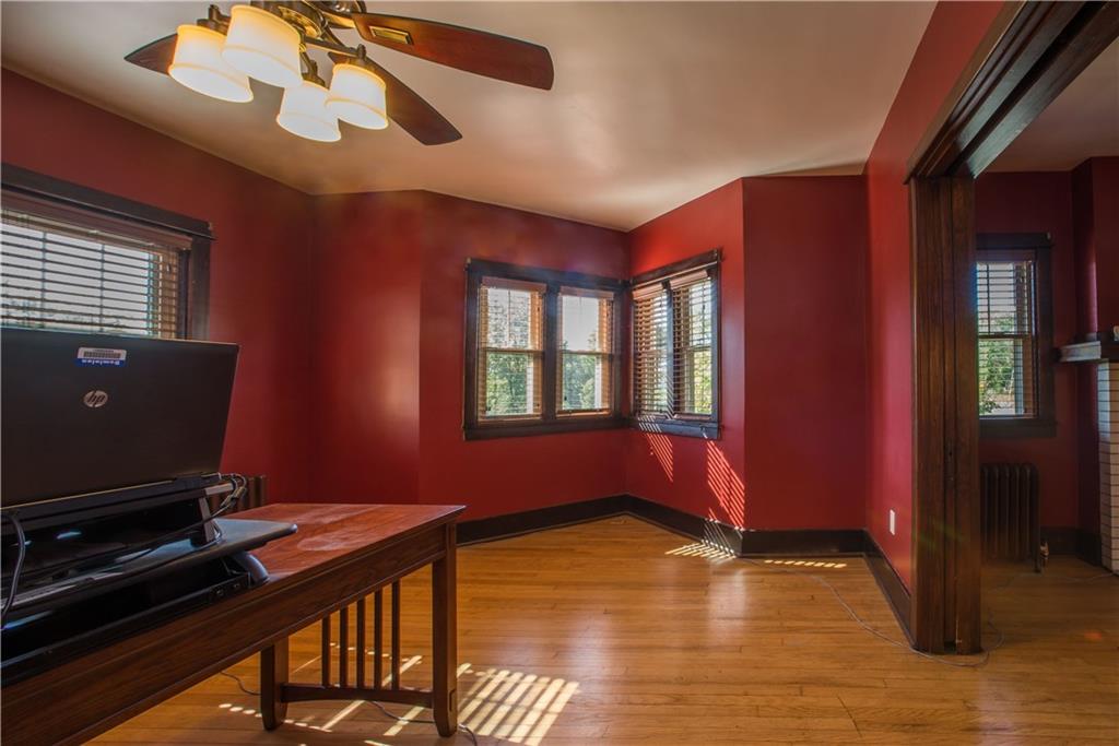 172 Bellbridge Road Elizabeth, PA 15037 - Photo 10 of 25 The dining and living rooms are separated by pocket doors (shown at the right of the photo). This is the dining room with hardwood floor, ceiling fan, and windows overlooking a koi pond and the right side of the home.