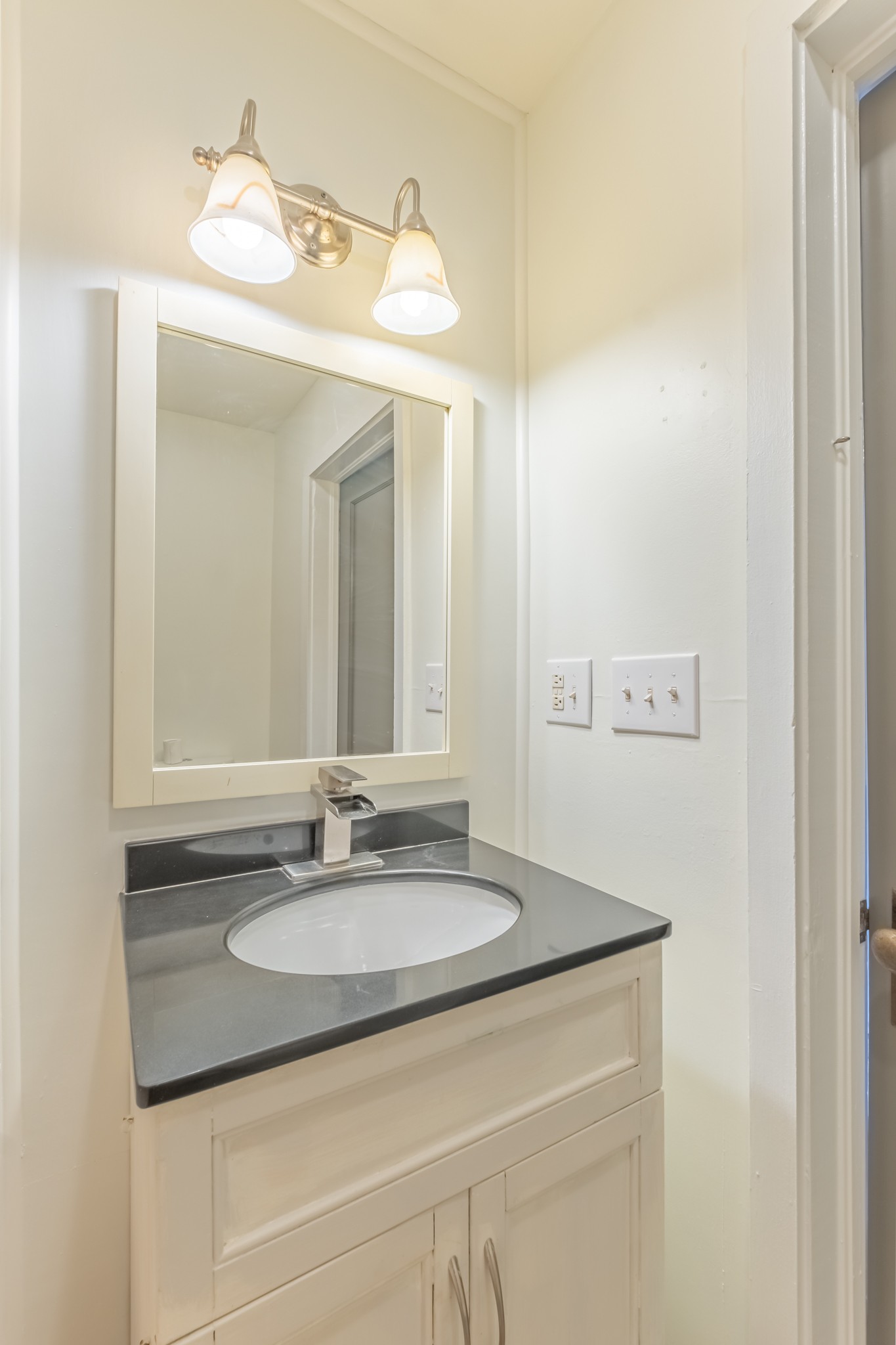 1322 Marble Hill Road Winchester, TN 37398 - Photo 17 of 32 a bathroom with a sink and a mirror