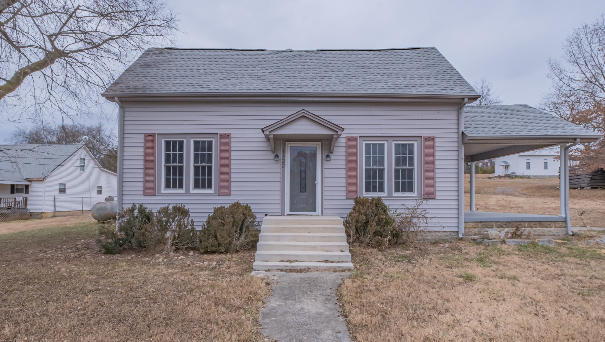 1322 Marble Hill Road Winchester, TN 37398 - Photo 2 of 32 a front view of a house with garden