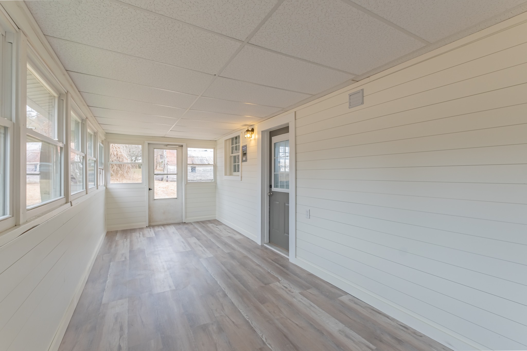 1322 Marble Hill Road Winchester, TN 37398 - Photo 26 of 32 a view of an empty room with a window and wooden floor
