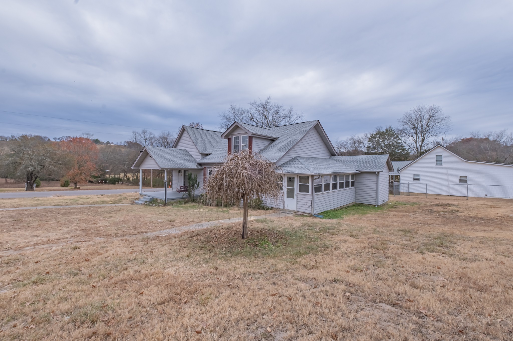 1322 Marble Hill Road Winchester, TN 37398 - Photo 27 of 32 a view of a big house with a big yard and large trees