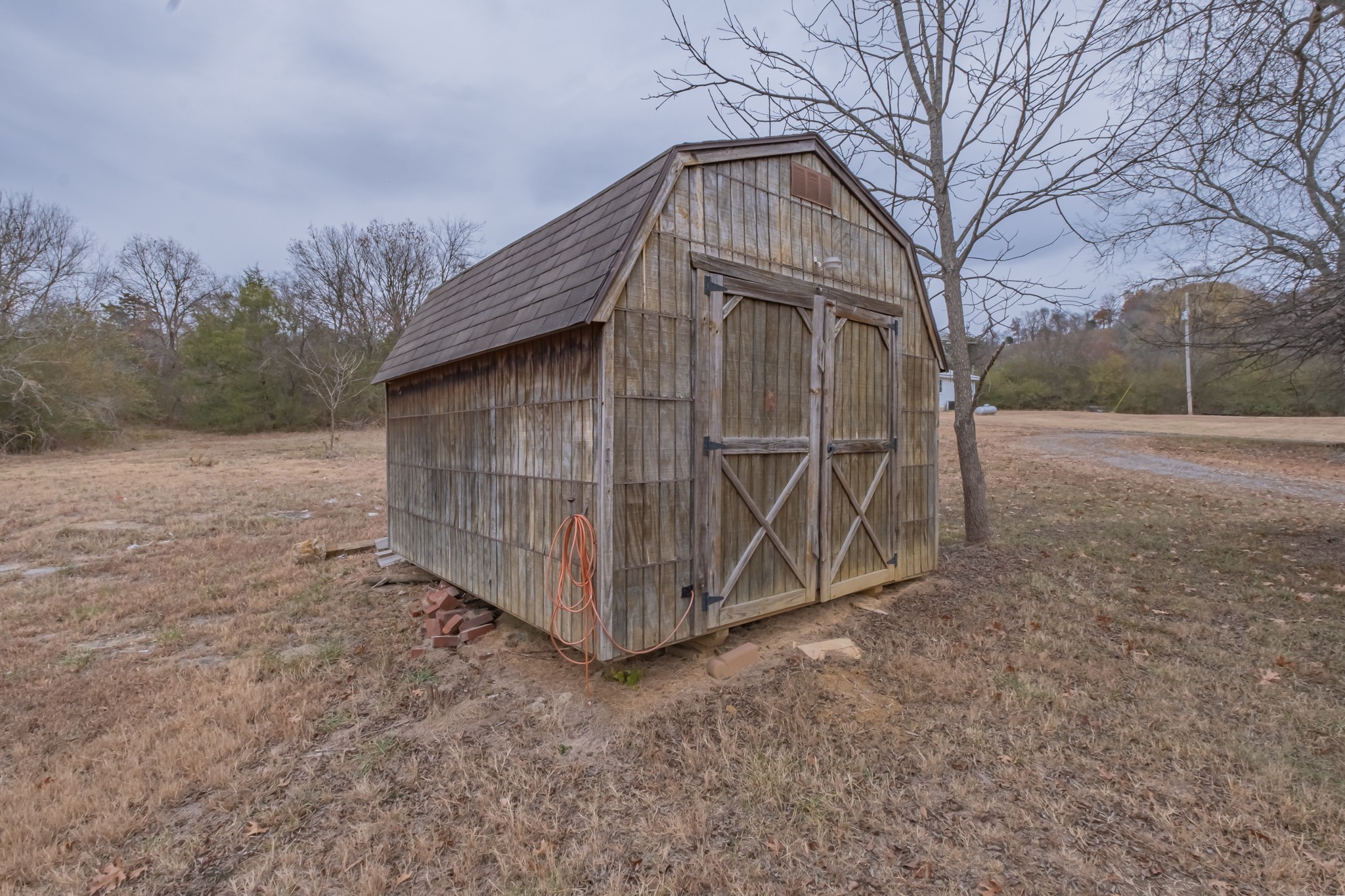 1322 Marble Hill Road Winchester, TN 37398 - Photo 30 of 32 a view of backyard with large trees and wooden fence