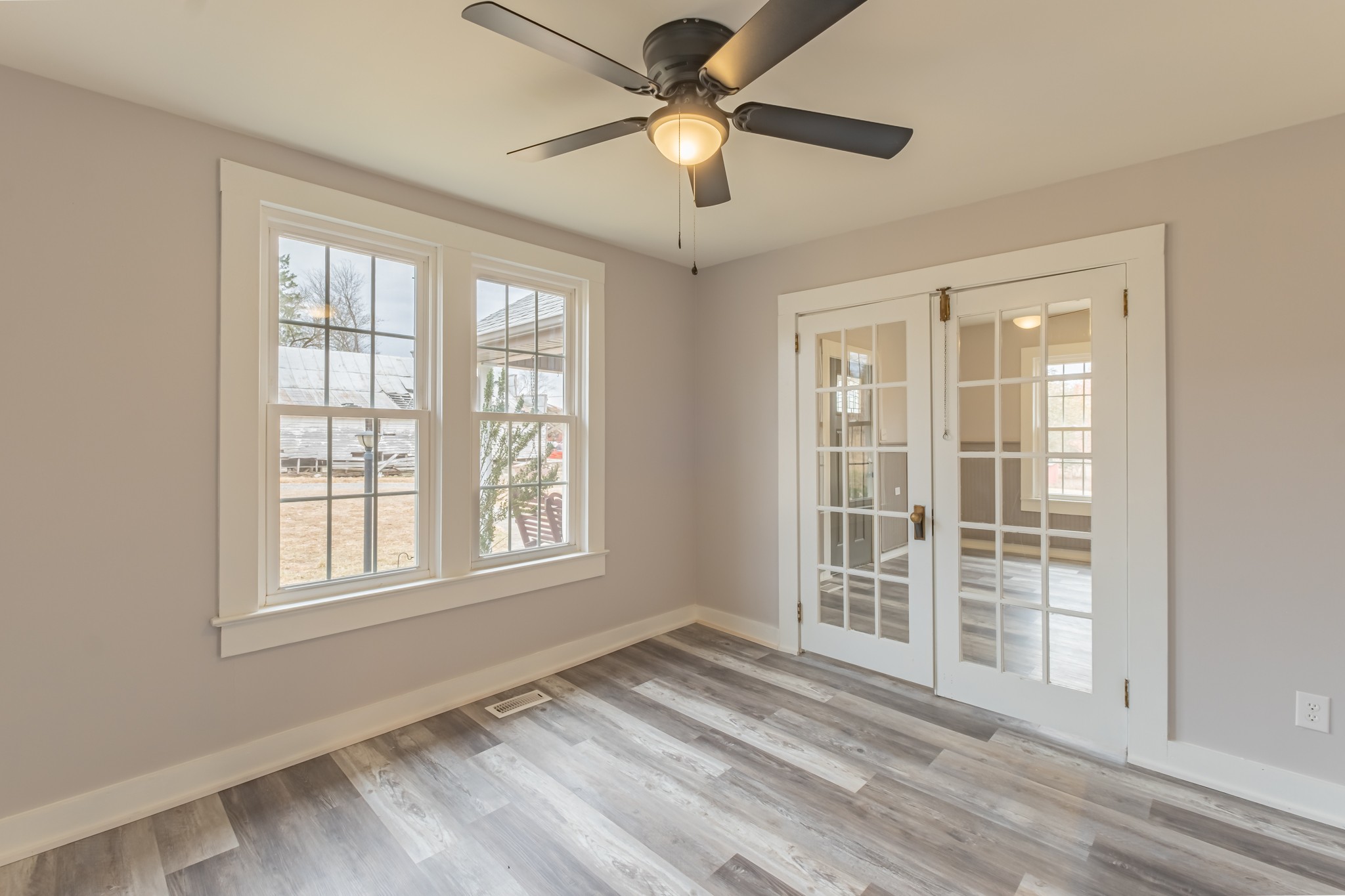 1322 Marble Hill Road Winchester, TN 37398 - Photo 9 of 32 a view of an empty room with a window and wooden floor
