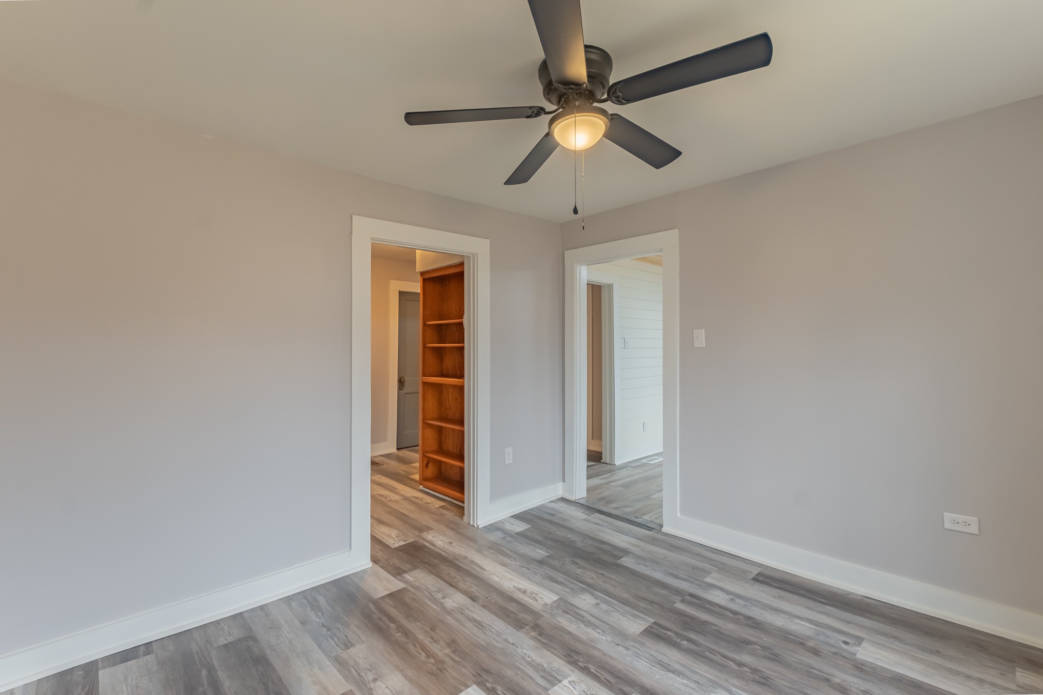 1322 Marble Hill Road Winchester, TN 37398 - Photo 10 of 32 an empty room with wooden floor fan and windows
