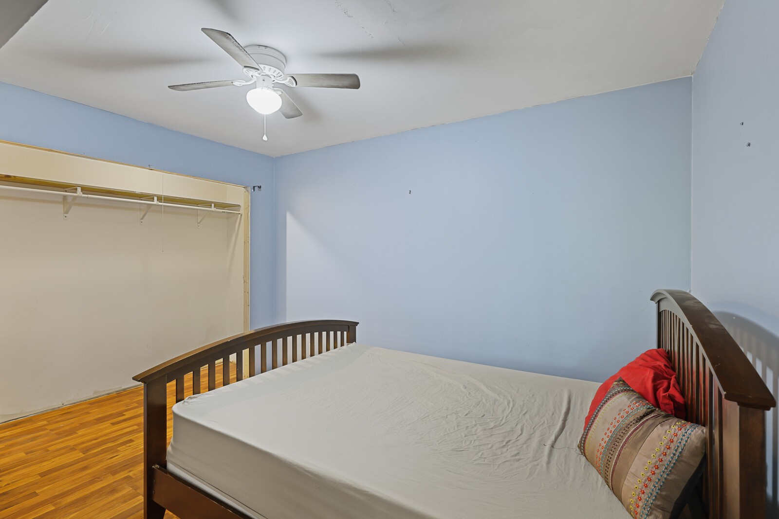 569 Moreland Road Manchester, TN 37355 - Photo 28 of 47 a view of a bedroom with a bed and wooden floor