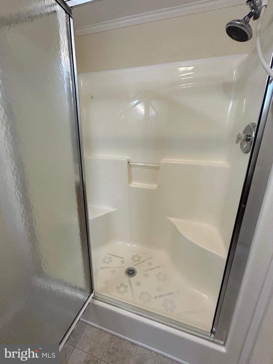 94 Random Road Douglassville, PA 19518 - Photo 15 of 27 a bathroom with a glass shower door